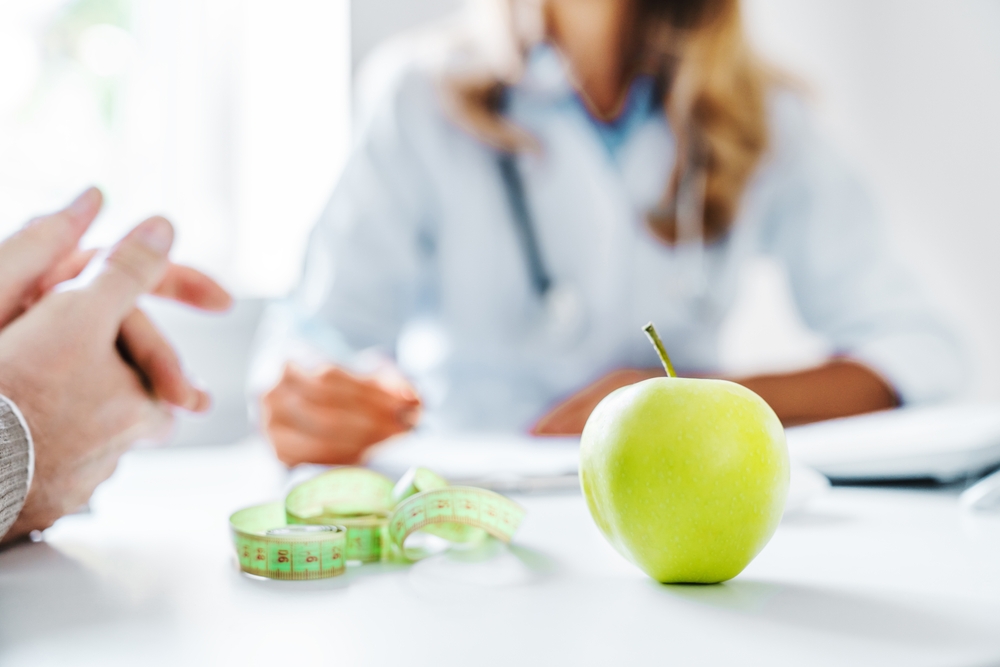 person speaking to medical provider about nutrition