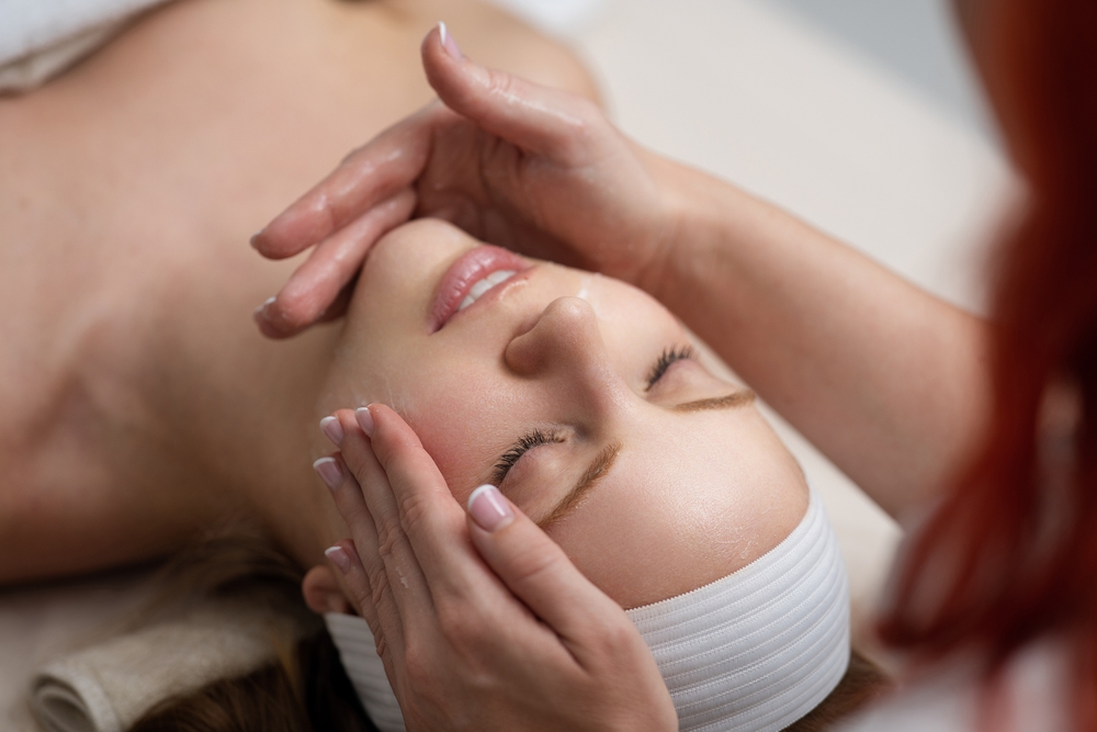 woman receiving facial treatment for skincare